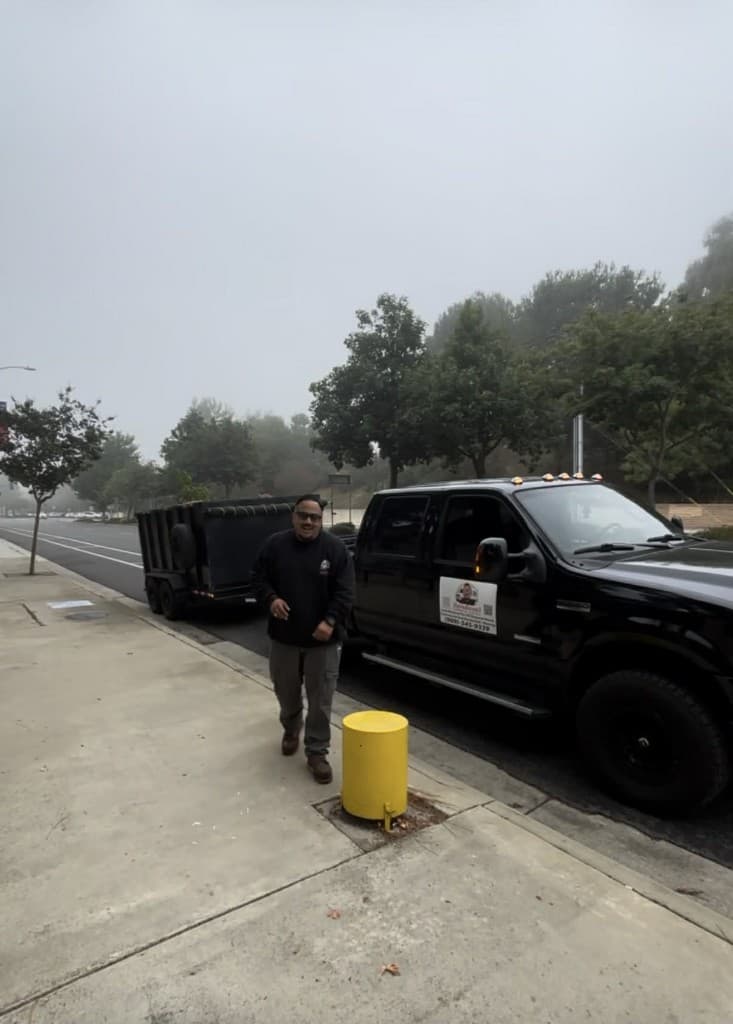 Sandoval Commercial Disposal owner with truck and trailer